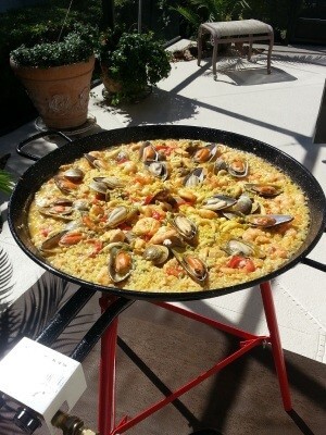 A hotel intern enjoying a traditional Spanish paella on the Canary Islands during their practical training in Spain, savoring the flavors of the local cuisine.